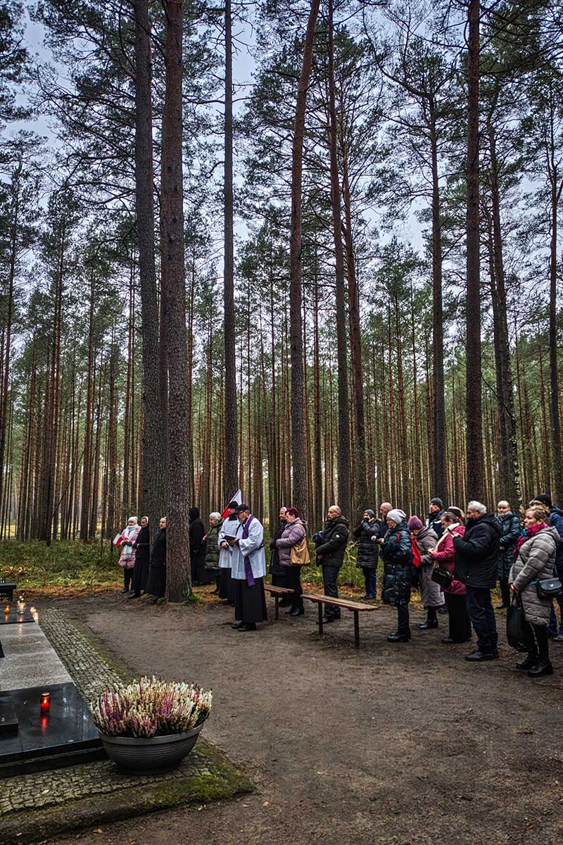 People pray in front of the tomb of Blessed Alicja Kotowska